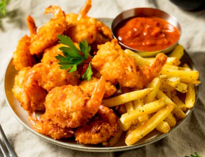 Breaded shrimp with fries and dipping sauce