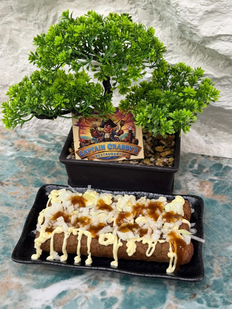 Frikandel speciaal with chopped onions and sauces